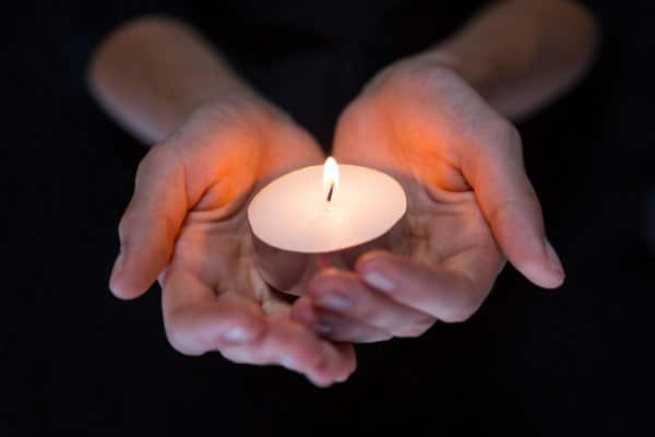depositphotos  stock photo hands holding candle