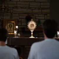 people-in-eucharistic-adoration-Photo-by-Matea-Gregg-on-Unsplash–scaled