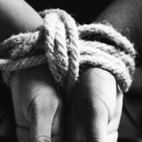 Hands tied with a rope